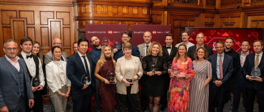 Small Business Growth Awards 2026 - winners photograph against a panelled wall.