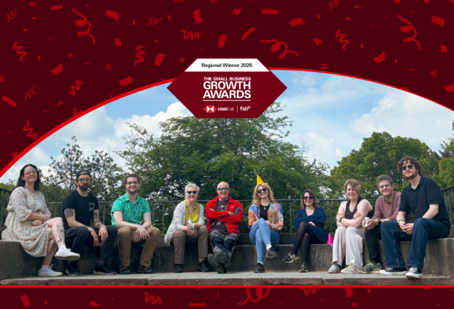 Smith Goodfellow team photo at Lyme Park out in the sunshine. This image has the Small Business Growth Awards logo in the centre and a banner across the top with confetti.