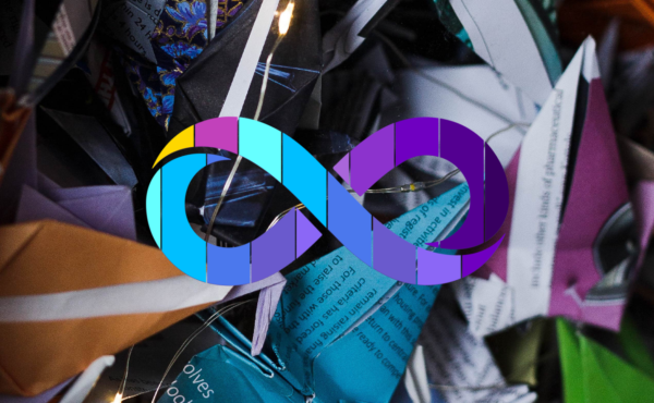 This image is a close up of origami cranes in lots of different colours with the Neurodiversity Pride logo which is a rainbow infinity loop to support this blog on inclusive recruitment.